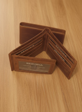 Load image into Gallery viewer, A brown Sedona buffalo leather wallet with 2 id windows, multiple card slots, and a cash compartment.