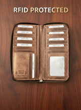Load image into Gallery viewer, A brown leather women's wallet with a double zipper, RFID protection, and multiple card slots, when opened.